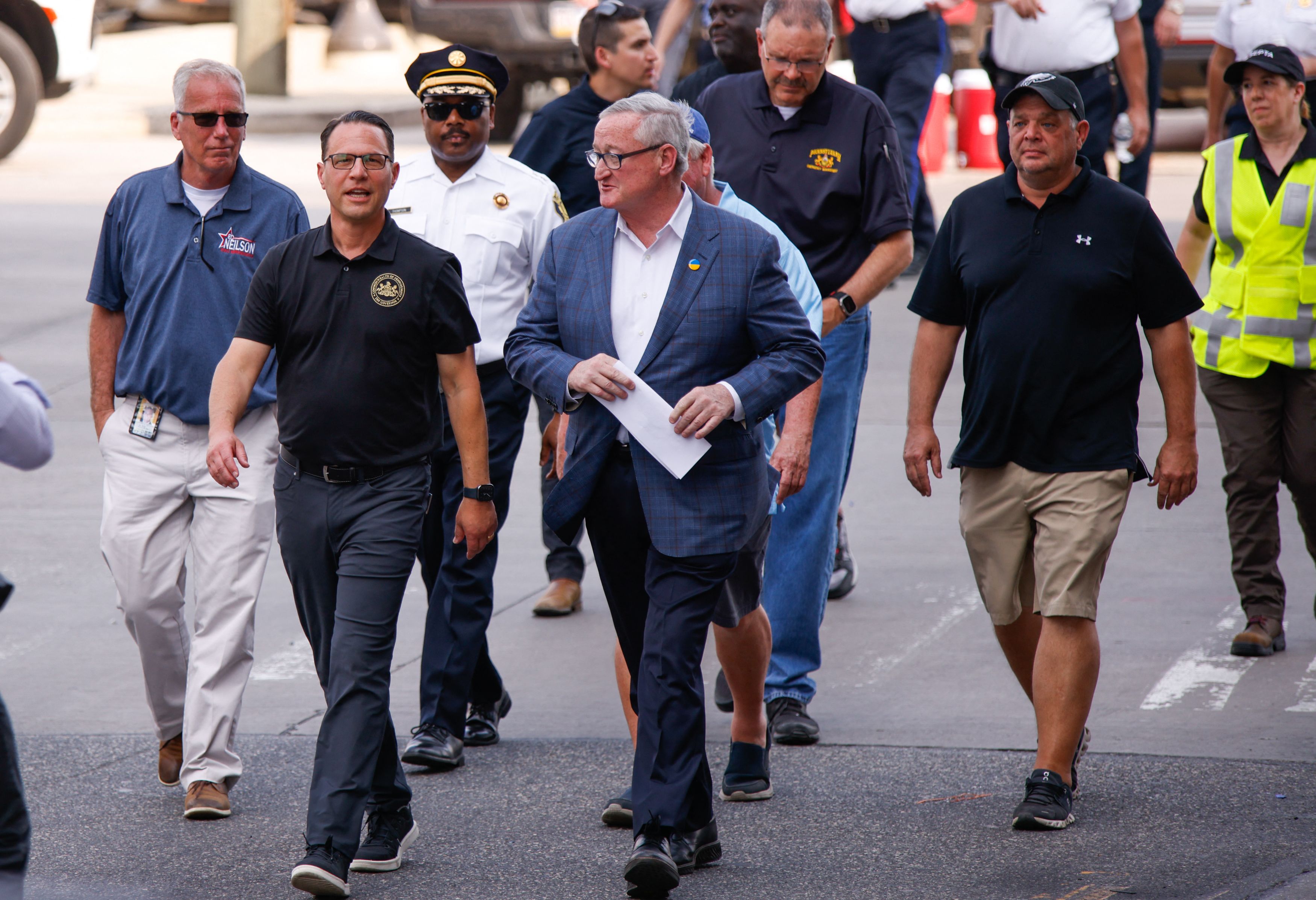 Pennsylvania Gov. Josh Shapiro (D) and Philadelphia Mayor James F. Kenney walk to speak to members of the media near a collapsed portion of Interstate 95 caused by a large vehicle fire, in Philadelphia on June 11, 2023.
