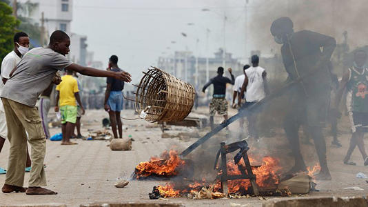 Demonstrators set up a barricade during a protest calling for President Faure Gnassingbe's resignation in Lome, Togo, Thursday, June 26, 2025.