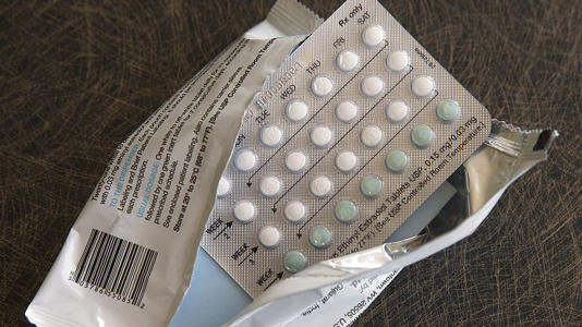 A photo shows a one-month dosage of hormonal birth control pills