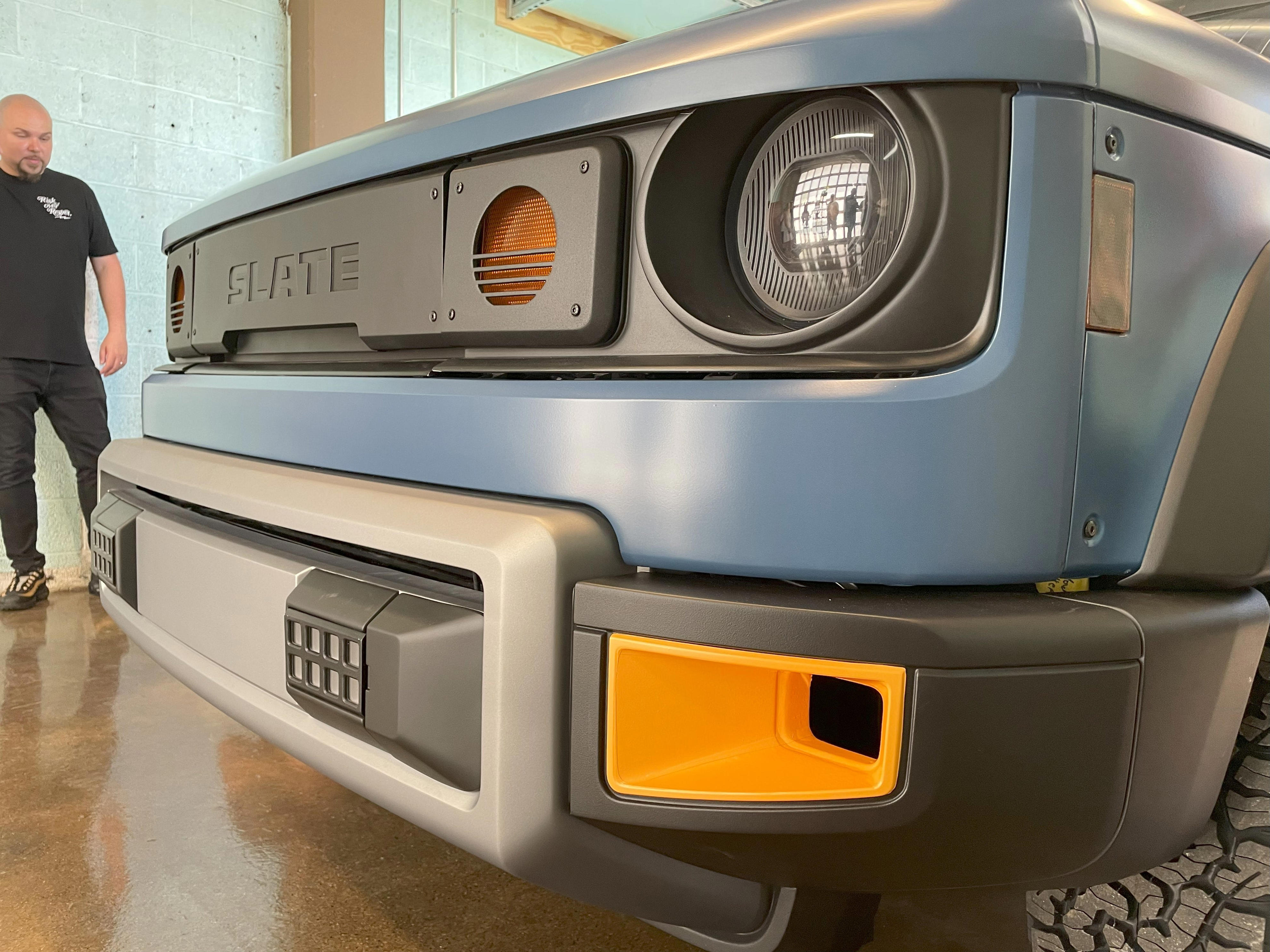 A startup back by billionaire Jeff Bezos plans to produce the electric Slate pickup at a plant in Warsaw, Indiana. A prototype of the EV truck was on display at the MOTO gathering space in Ferndale on Sunday, June 29.