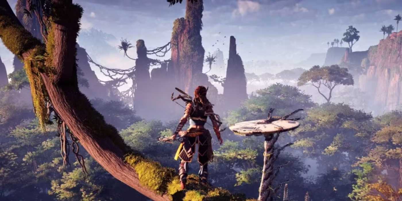 Aloy is overlooking the open world from a tree, and a Tallneck robot is walking below.