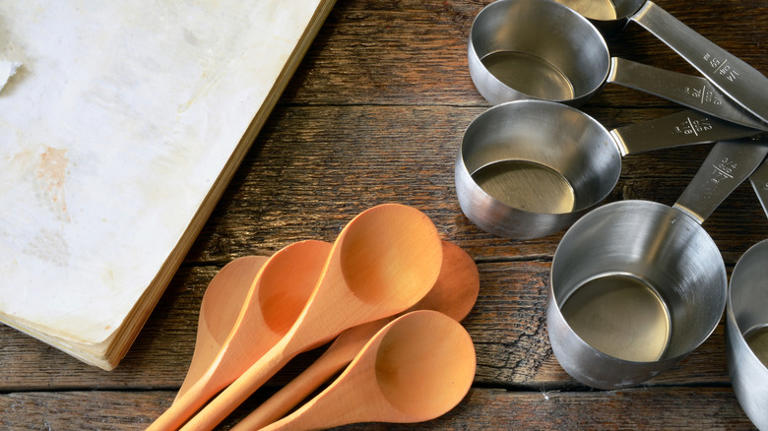 Don't Throw Out Those Old Measuring Cups — Use Them In The Garden Instead
