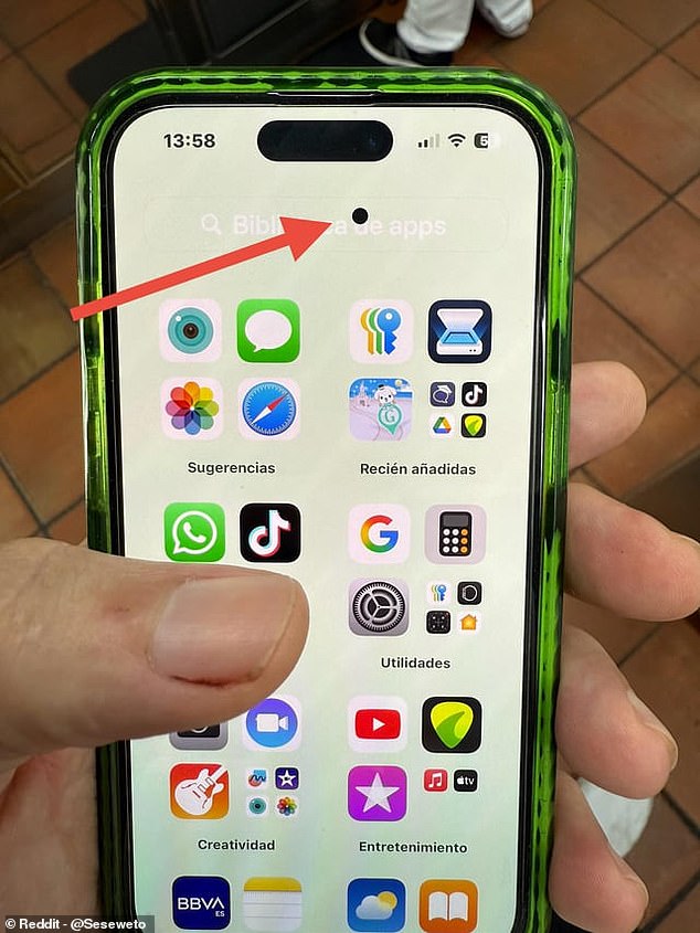 iphone 15 small black dot on screen