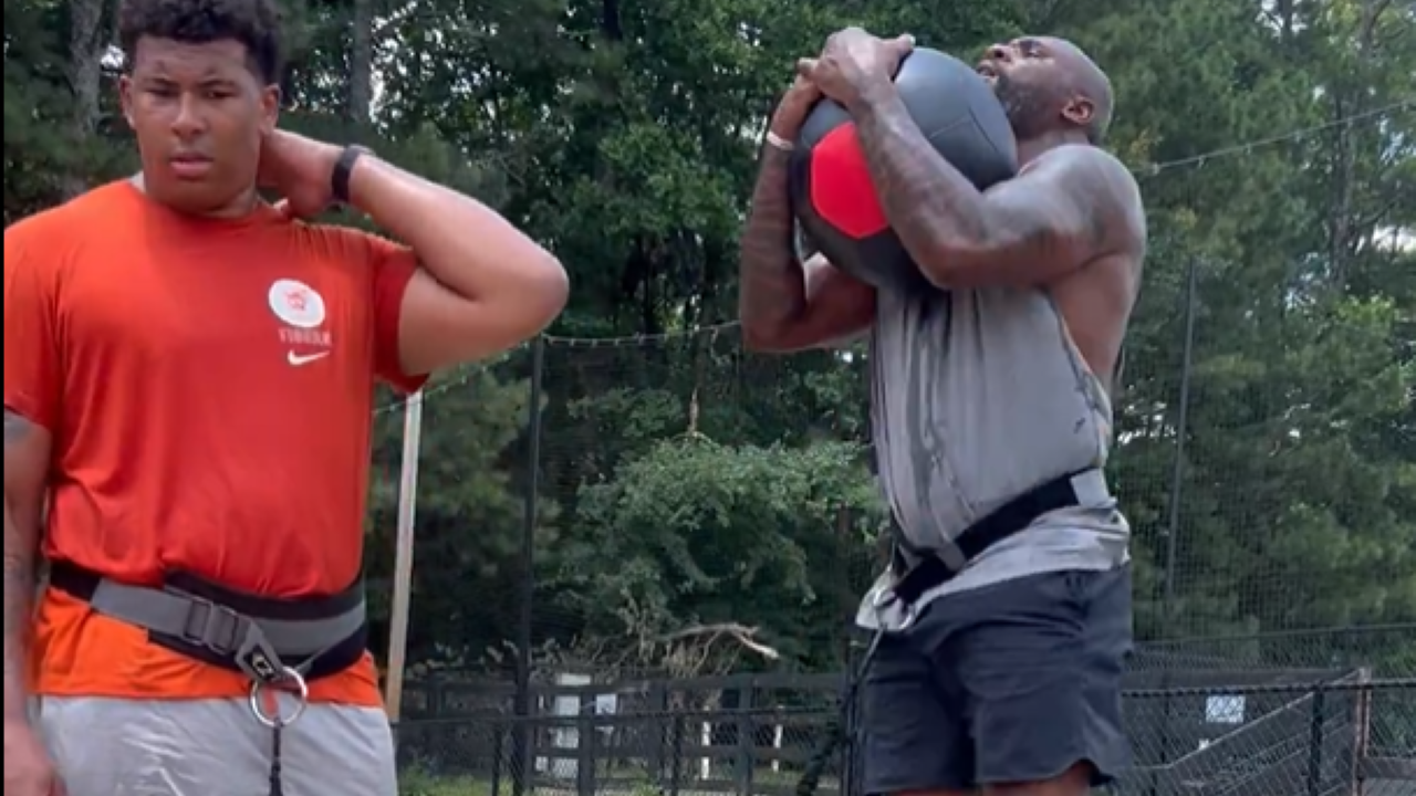 NFL legend Brandon Jacobs is videotaped training with his son Brayden ...