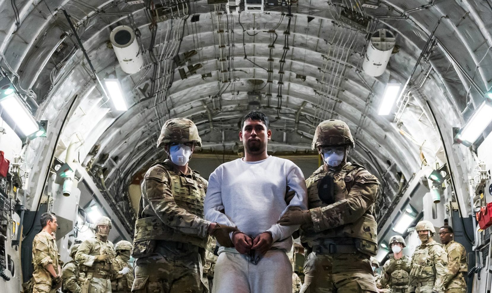 The deportation flights have drawn fierce criticism… and outlandish theories(Picture: Reuters)