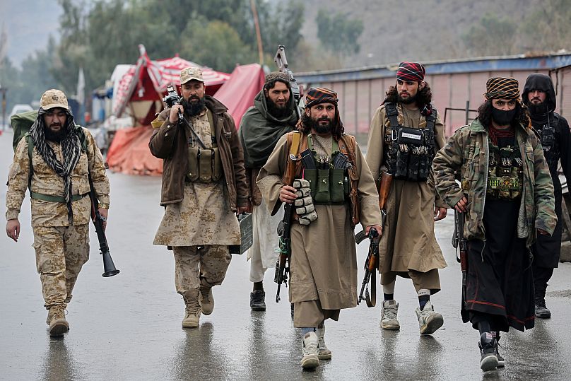 Taliban fighters patrol near the closed Torkham border with Pakistan, 3 March, 2025 AP Photo