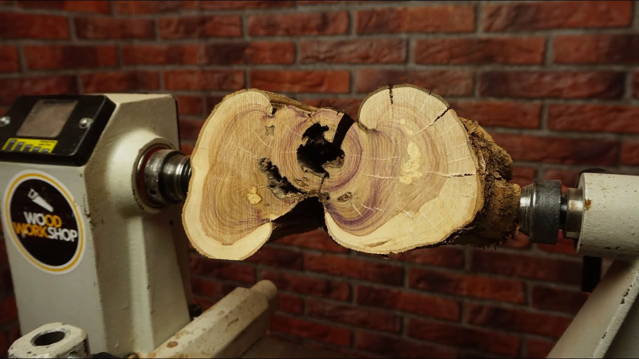 A woodworker turns a park-found wood blank into a goblet