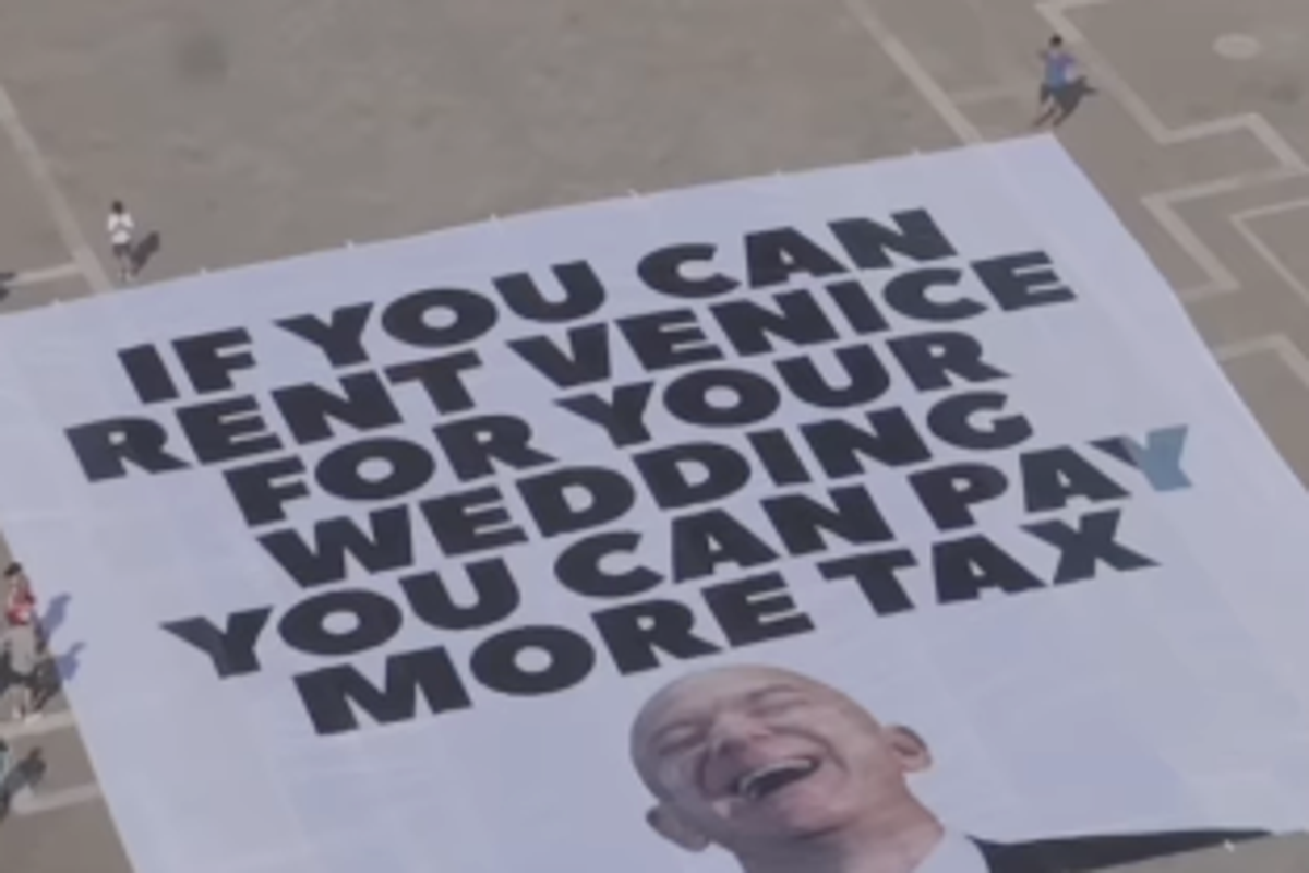 Protesters unfurl huge anti-Bezos banner in Venice ahead of Amazon ...