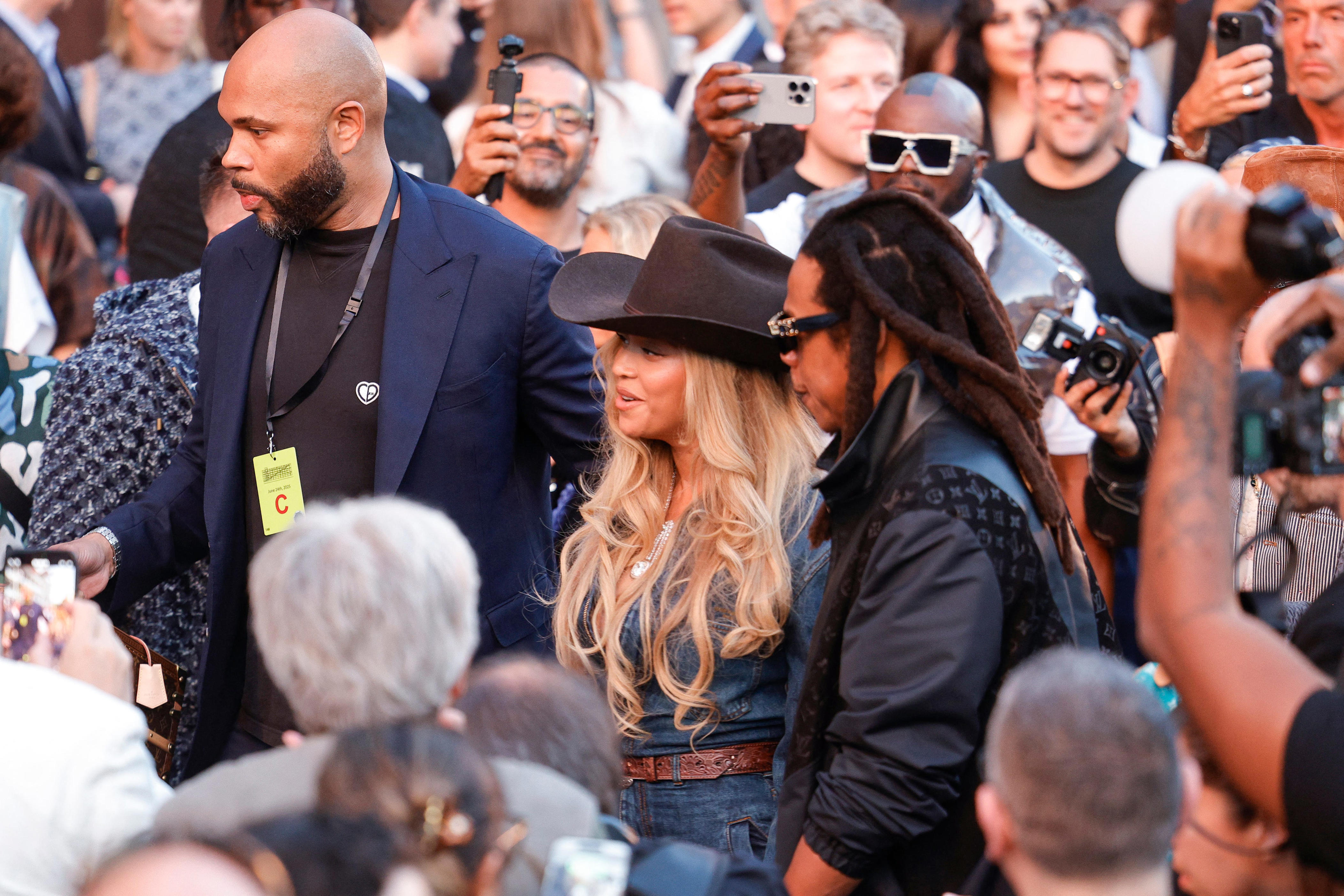 Beyoncé and Jay-Z photographed at the Louis Vuitton fashion show on June 24, 2025.