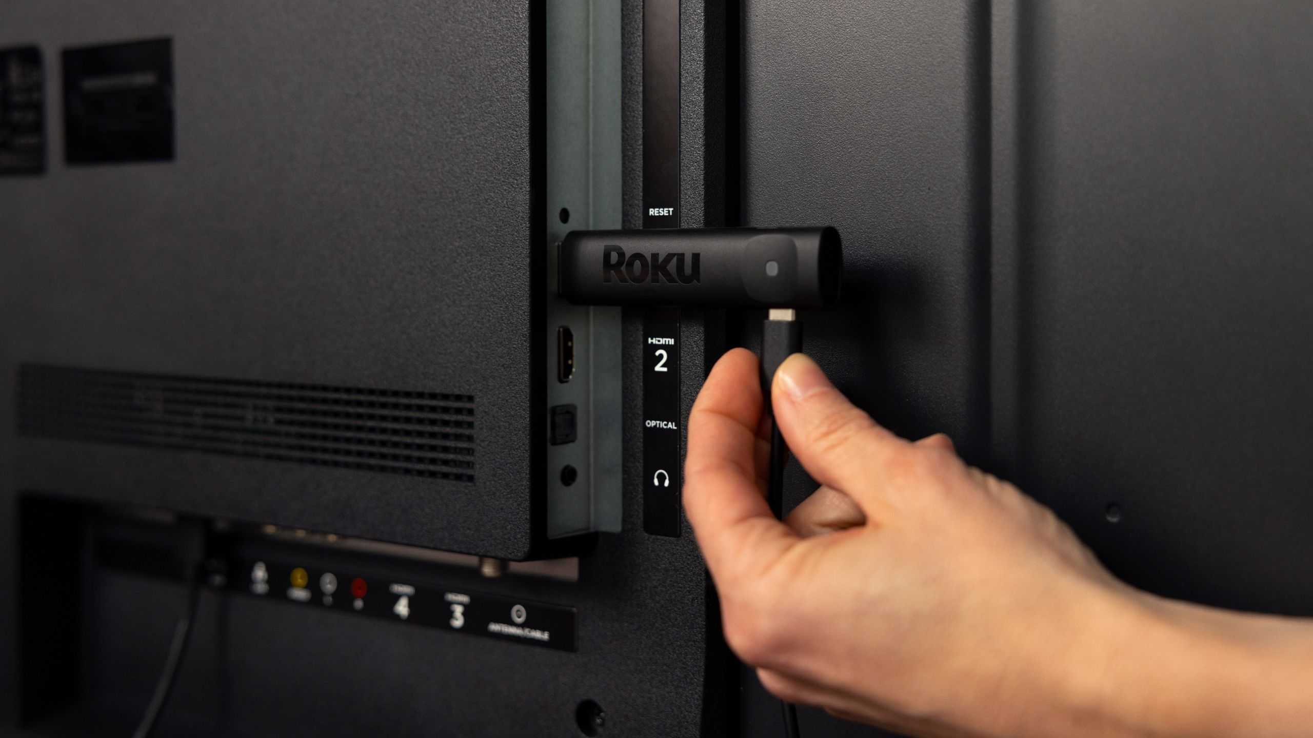 Roku Streaming Stick being plugged in