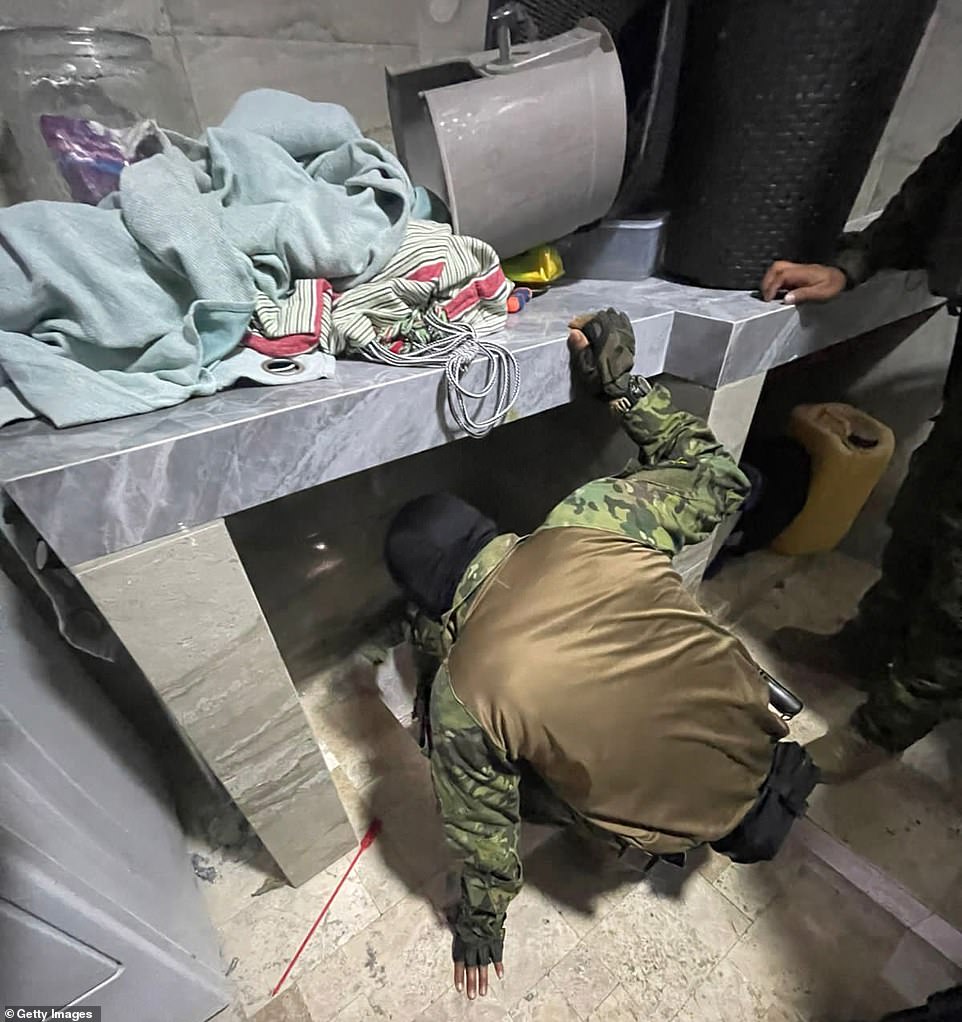 Ecuador's most-wanted drug lord found beneath trapdoor