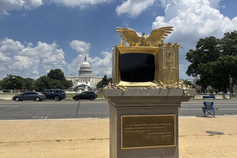 The artwork depicts a golden TV