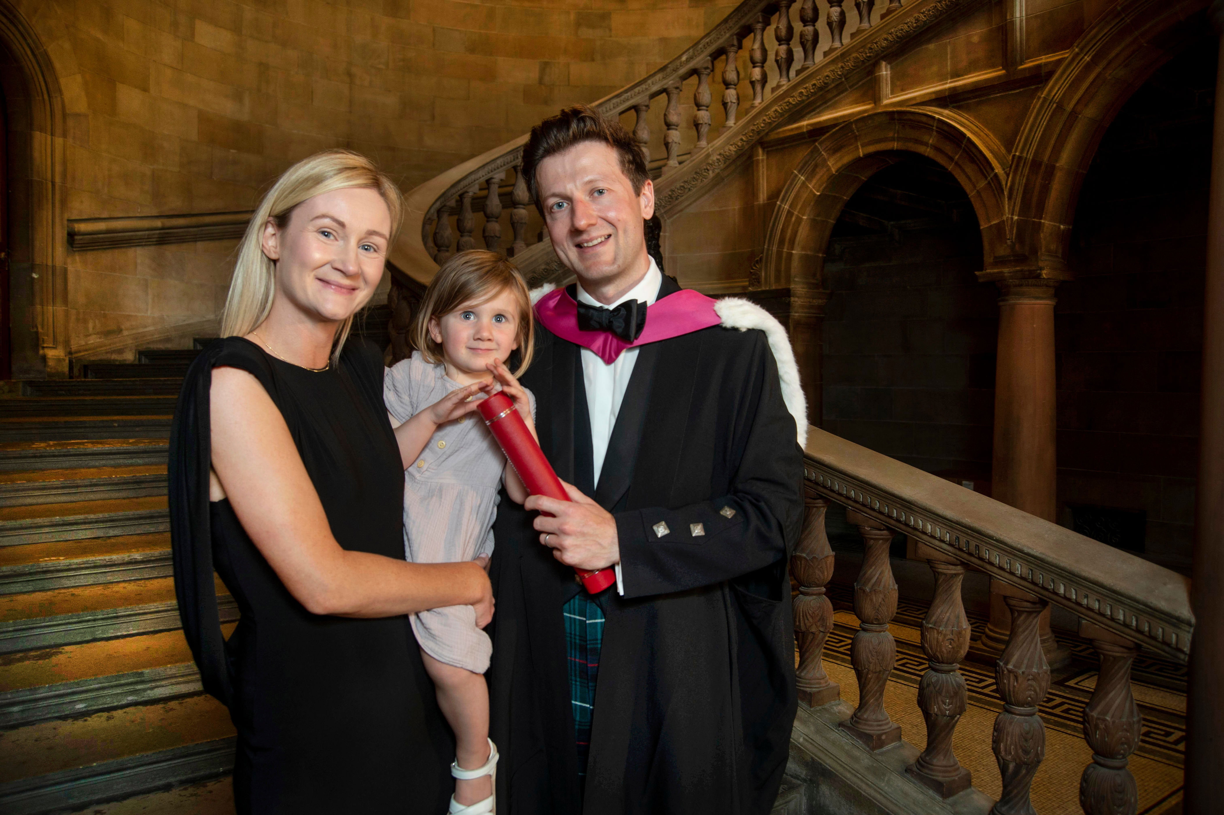 Graduate Calum MacDonald with his wife Debbie and daughter Freya (Douglas Robertson/PA)