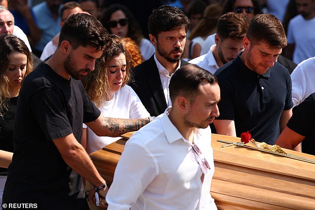 Rute Cardoso helps as pallbearers carry a coffin, at the funeral ceremony of her late husband Liverpool's Portuguese soccer player Diogo Jota and his brother Andre Silva 
