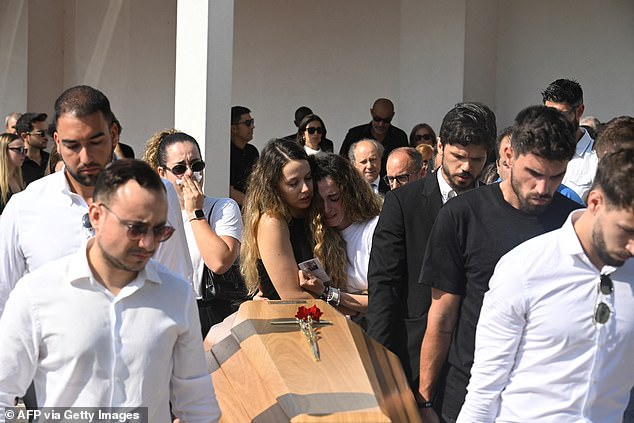 Rute was consoled by friends and family who held her up as she walked behind the coffin clutching an order of service