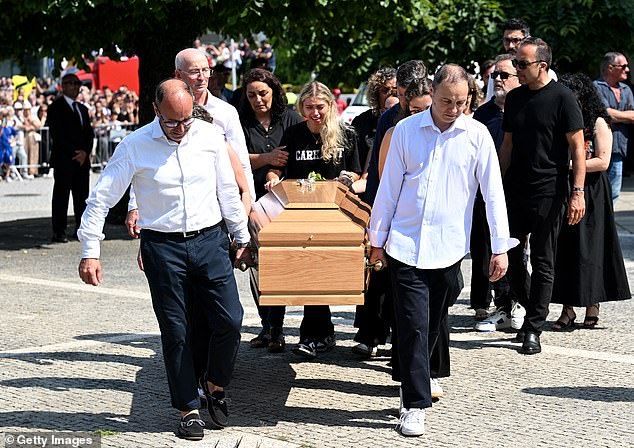 Maria Rodrigues, wife of Silva, was in floods of tears as she walked behind her husband's coffin along with pall bearers and family and friends 