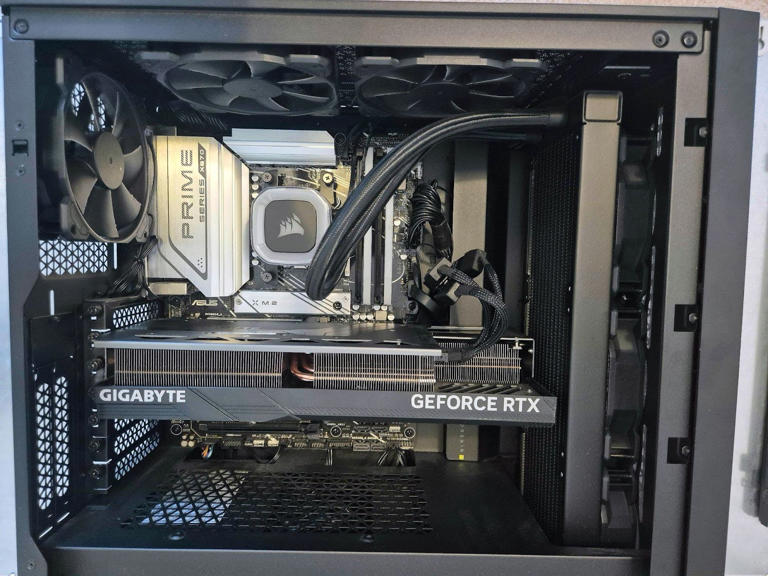 The inside of a PC case with an RTX 4080 Super graphics card installed.