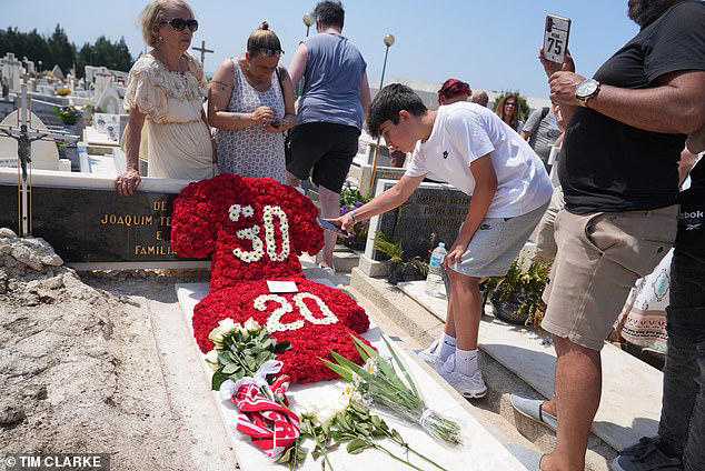 Floral tributes bearing the shirt numbers of Diogo Jota and his brother Andre Silva were placed on their graves in a cemetery in Gondomar