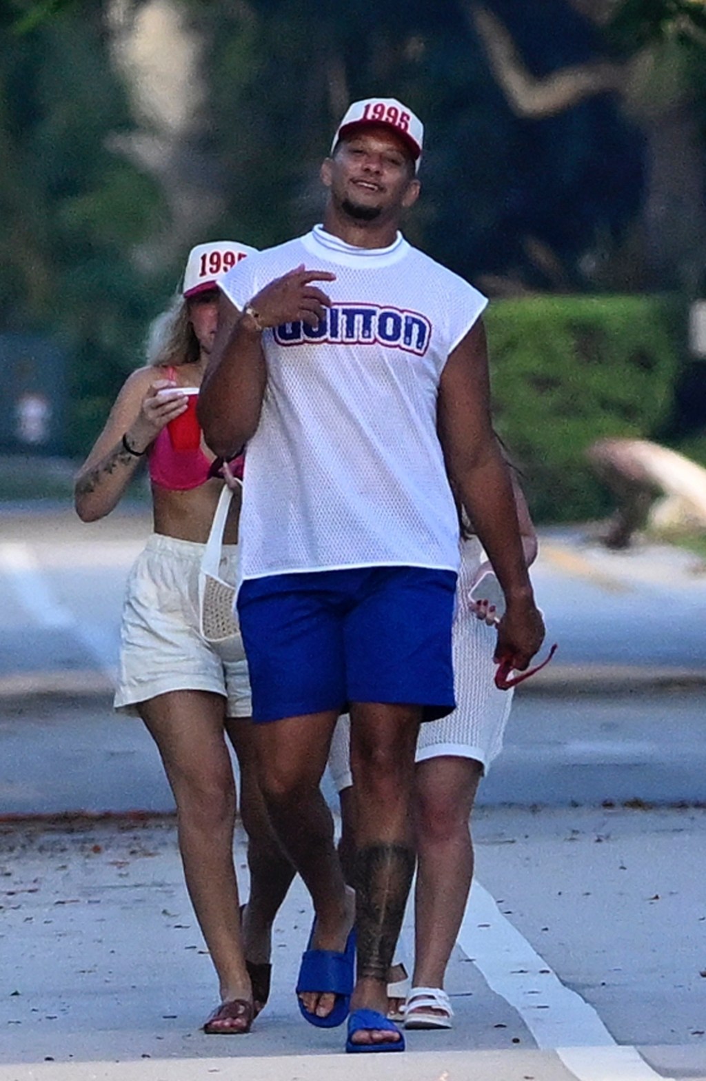 Patrick wore blue swim trunks. BACKGRID