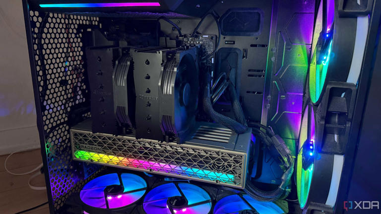 A photo of a PC build powered on with RGB lights and an air cooler