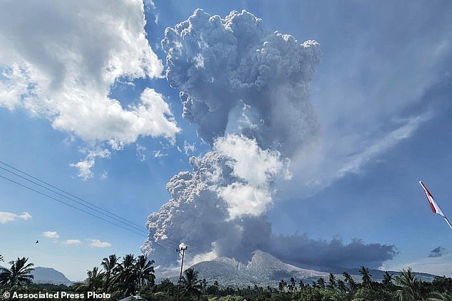 Astonishing footage shows giant volcano erupting with 63,000 ft of toxic ash cloud