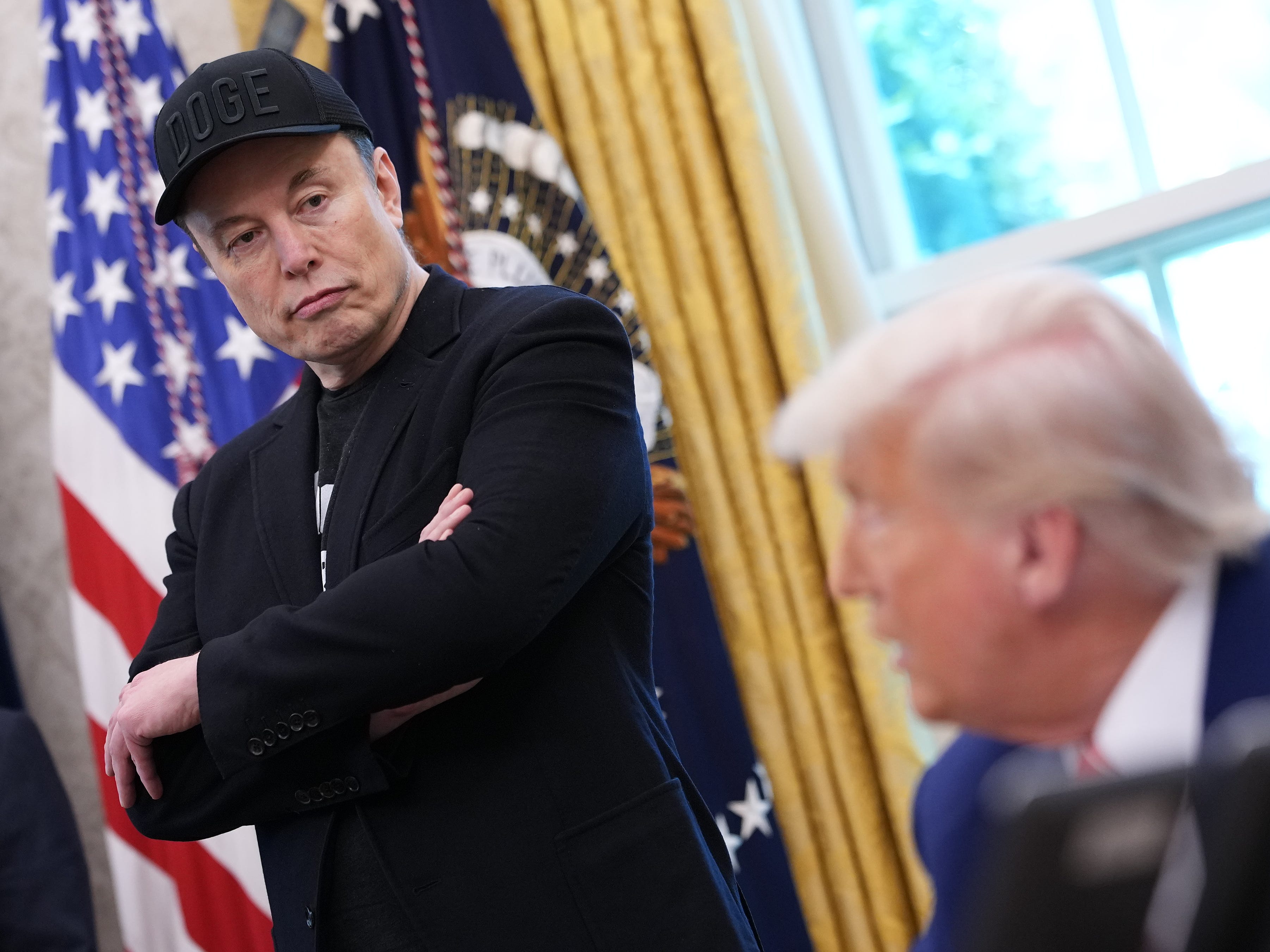 An anti-DEI investment firm postponed its Tesla ETF, saying Elon Musk