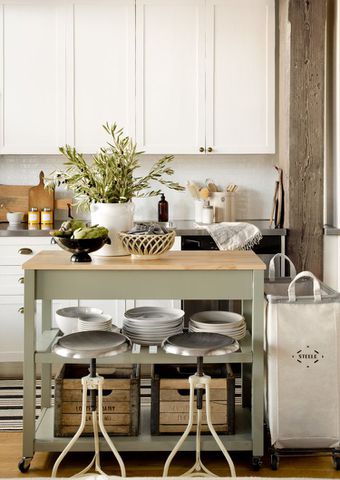 small kitchen with sage green island