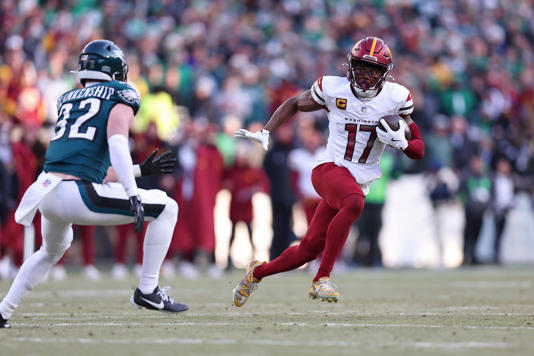 Jan 26, 2025; Philadelphia, PA, USA; Washington Commanders wide receiver Terry McLaurin (17) runs with the ball for a touchdown against the Philadelphia Eagles during the first half in the NFC Championship game at Lincoln Financial Field. Mandatory Credit: Bill Streicher-Imagn Images