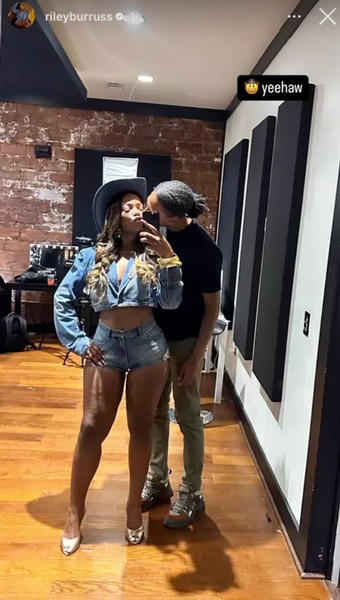 Riley Burruss wearing denim shorts and a denim top with her romantic interest next to her.