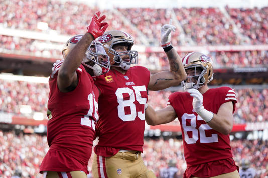 San Francisco 49ers wide receiver Jauan Jennings (15) celebrates with tight end George Kittle (85) and tight end Ross Dwelley (82) after catching a touchdown pass against the New Orleans Saints in the second quarter at Levi's Stadium. Cary Edmondson-USA TODAY Sports