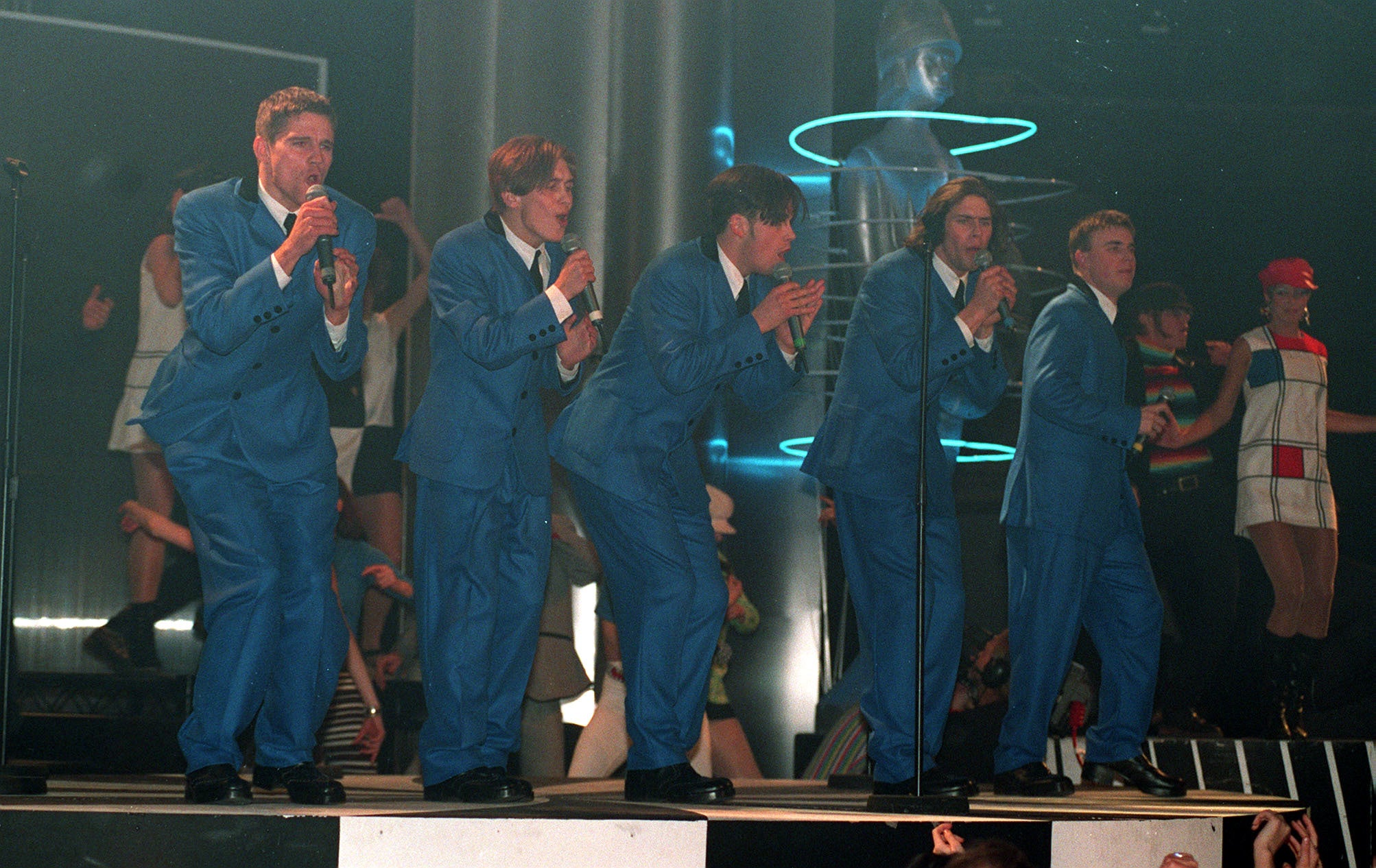 Suits you, sir: Take That performing at the Brit Awards ceremony at Alexandra Palace, London, in 1994 (PA)