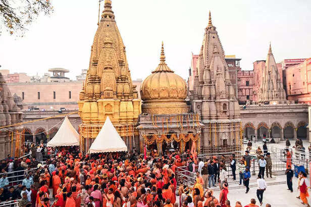 Varanasi, Feb 26 (ANI)_ Naga Sadhus visit the Kashi Vishwanath Temple on the occ....