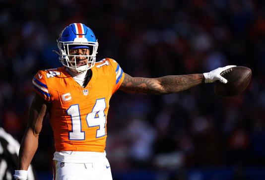 Jan 5, 2025; Denver, Colorado, USA; Denver Broncos wide receiver Courtland Sutton (14) following a first down reception in the first quarter against the Kansas City Chiefs at Empower Field at Mile High. Mandatory Credit: Ron Chenoy-Imagn Images