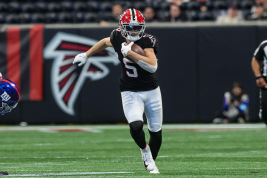 Dec 22, 2024; Atlanta, Georgia, USA; Atlanta Falcons wide receiver Drake London (5) runs after a catch against the New York Giants in the third quarter at Mercedes-Benz Stadium. Mandatory Credit: Brett Davis-Imagn Images