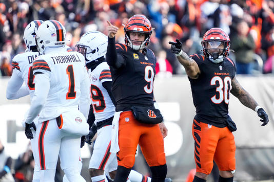 Cincinnati Bengals quarterback Joe Burrow (9) and running back Chase Brown (30) celebrate after a first down run by Burrow in the second quarter of the 2024 NFL Week 16 game between the Cincinnati Bengals and the Cleveland Browns.