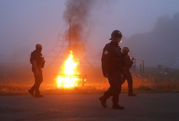 Migrants fight with police in France as petrol bombs and rocks launched ...