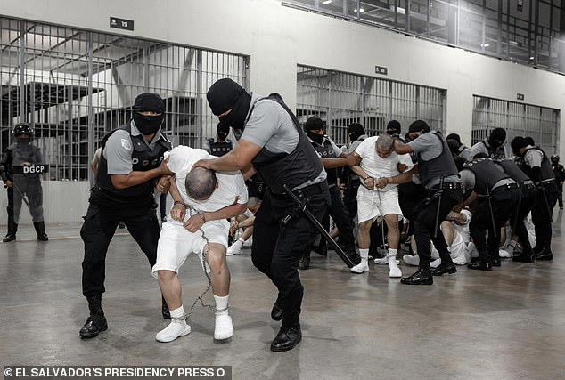 Prisoners are handled by CECOT prison guards inside the sprawling facility 