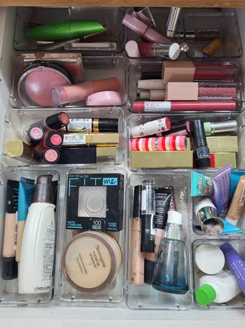 Drawer filled with various beauty products organized in the drawers