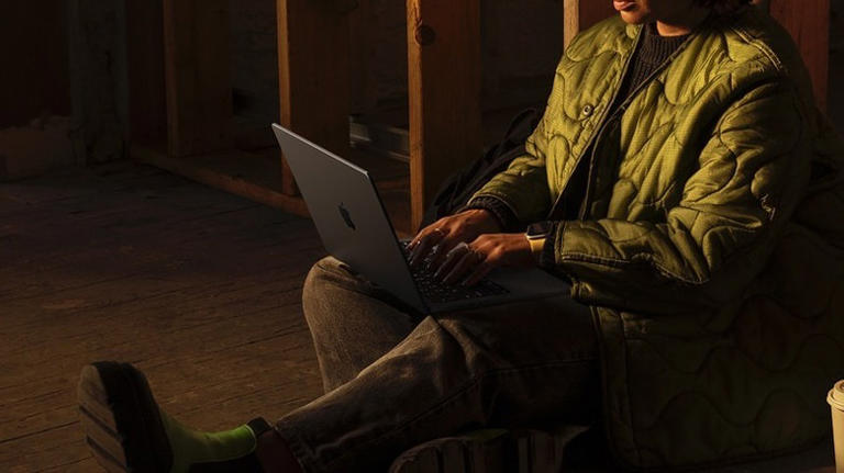 Woman using MacBook Pro on laptop