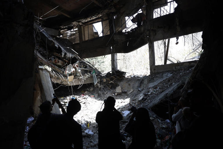 epa12208092 Members of the media report from a damaged section of Evin Prison after recent Israeli airstrikes, in Tehran, Iran, 01 July 2025. Iran's judiciary stated that at least 71 people were killed in Israeli airstrikes on Evin Prison, which occurred on 23 June 2025. This incident took place during the 12-day Iran-Israel conflict, which started on 13 June. A US-mediated ceasefire between Iran and Israel was announced on 24 June. EPA/ABEDIN TAHERKENAREH