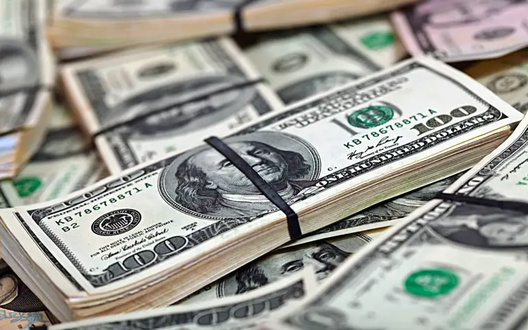 Dollar set for first monthly gain since October
