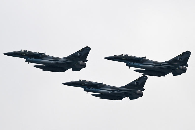 Pakistan Air Force J-10C fighter jets perform at a rehearsal ahead of Pakistan's national day parade in Islamabad on March 21, 2024.
