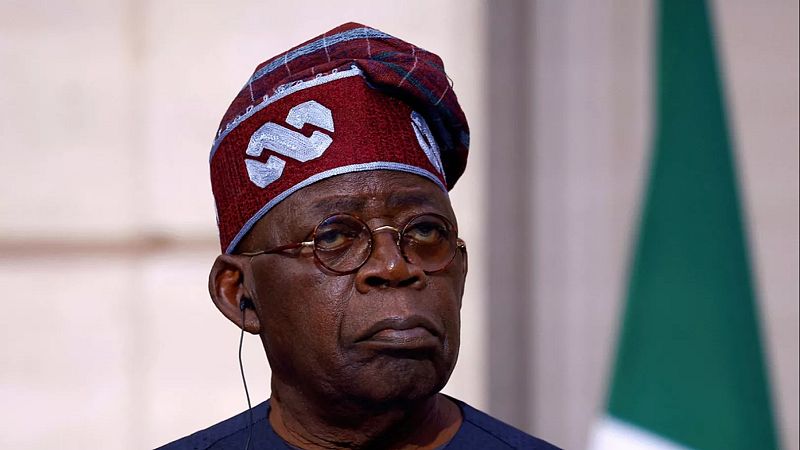 FILE - Nigerian President Bola Tinubu listens to French President Emmanuel Macron during a statement