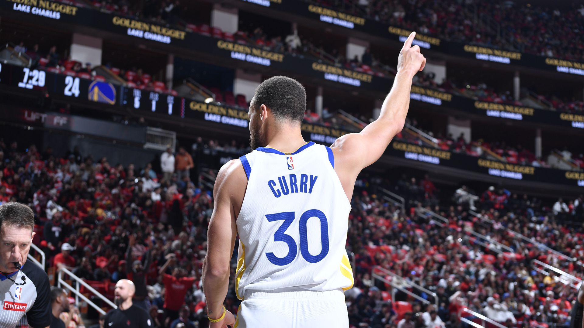 Steph Curry points at one of the many giant centers the Warriors will face during the NBA Cup
