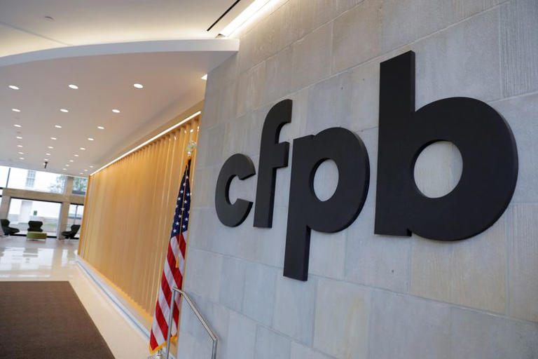 FILE PHOTO: Signage is seen at the Consumer Financial Protection Bureau (CFPB) headquarters in Washington, D.C., U.S., May 14, 2021. REUTERS/Andrew Kelly/ File Photo