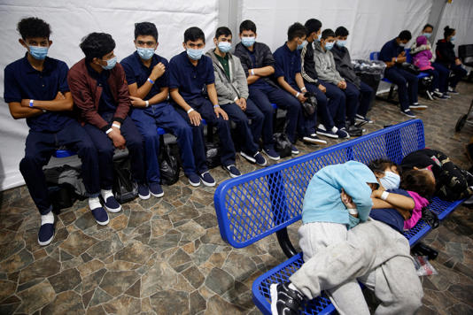 This 2021 photo, during the Biden administration, shows young unaccompanied migrants waiting at a processing station inside a U.S. Customs and Border Protection facility in Texas. (AP Photo/Dario Lopez-Mills)