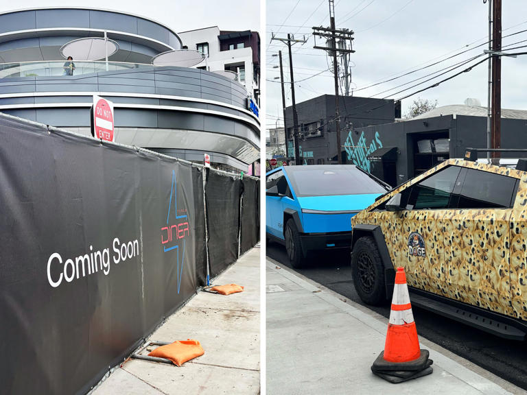 At midday, a "Coming Soon" fence around the perimeter of the diner and Cybertrucks parked on the street by the diner. (Angela Yang / NBC News)