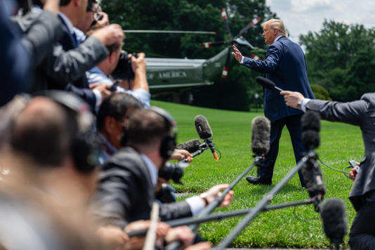 Trump speaks to reporters alongside White House press secretary Karoline Levitt on the South Lawn of the White House, on July 15.
