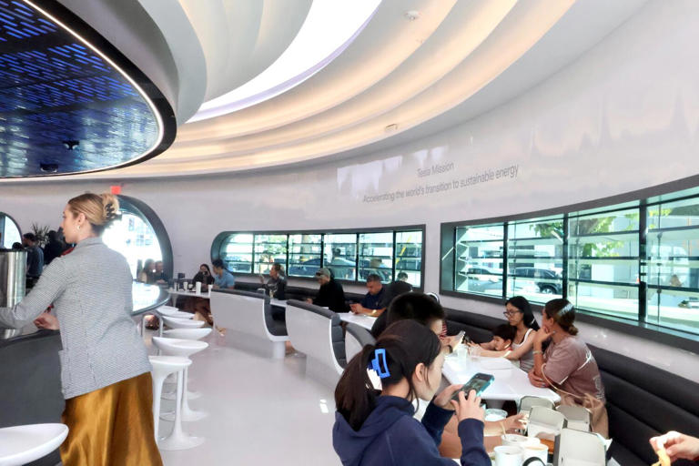 Across the bar at the Tesla Diner reads a Tesla mission statement: "Accelerating the world's transition to sustainable energy." ((Lauren Ng / Los Angeles Times))