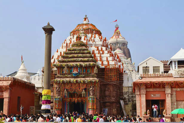 Temple adorned with vibrant garlands, celebrating faith and tradition.